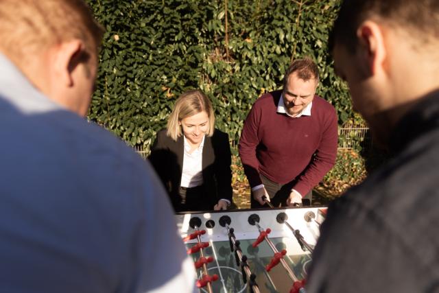 4 Famobra people playing table football in their break
